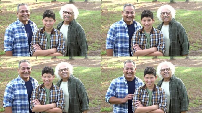 西班牙裔男孩，父亲和祖父站在公园里
