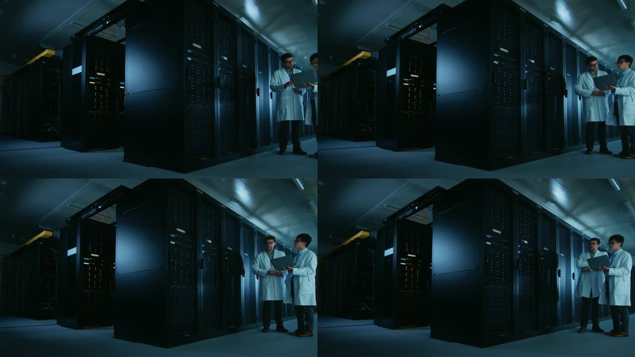 在数据中心: 两名穿着白大褂的IT专家讨论了服务器机架的工作。数据库优化工作。云计算、人工智能联网