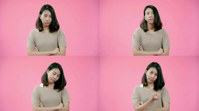 自信漂亮漂亮的亚洲女人愤怒严肃的脸穿着休闲服装严肃地看着相机在粉色背景下拍摄。青春与美丽的概念。
