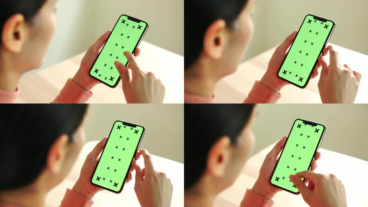 女人用手机绿屏实拍视频素材绿布绿幕