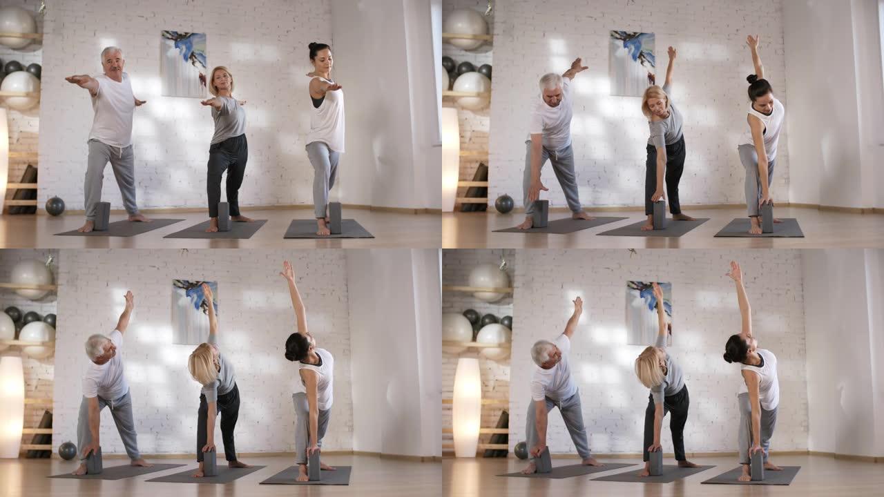 高加索夫妻在工作室与老师一起做瑜伽