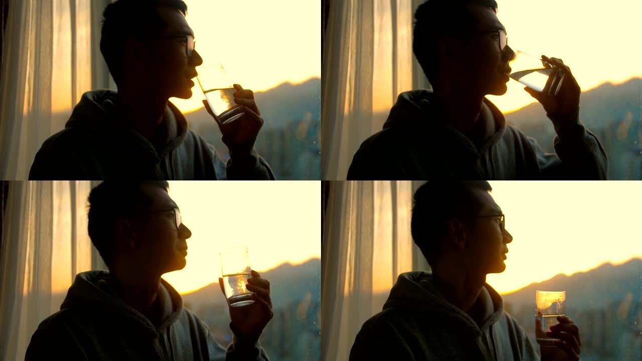 男子早上喝水喝水健康饮食生活方式剪影
