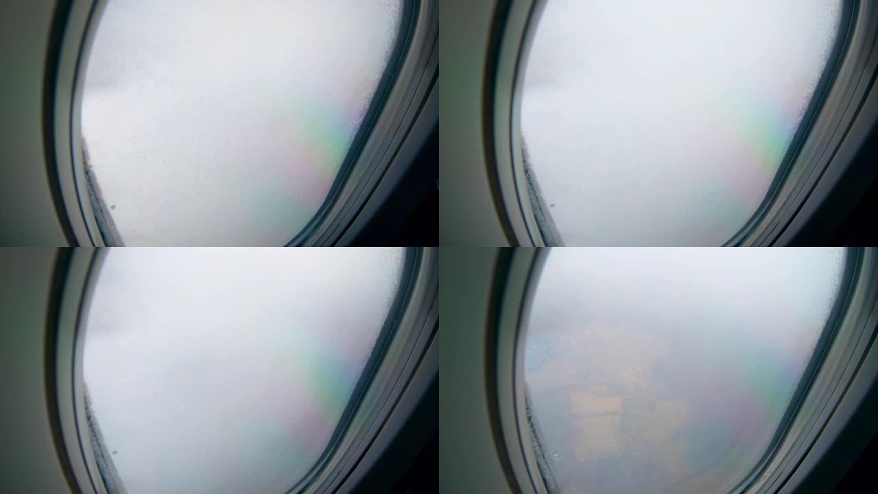 飞机在云中飞行，从机舱窗户可以看到。