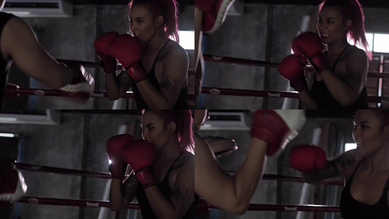 一名女拳击手在拳击场内拳打脚踢的特写镜头。女性接受拳击训练。运动教练