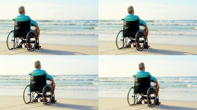 残疾老人在海滩上观看4k的后视图