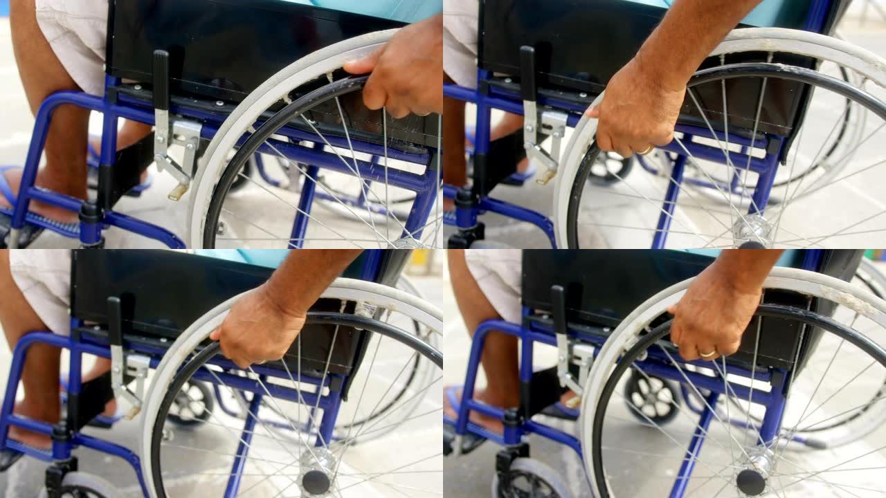 残障活跃的非裔美国人老年人在promenade 4k上移动轮椅的特写镜头