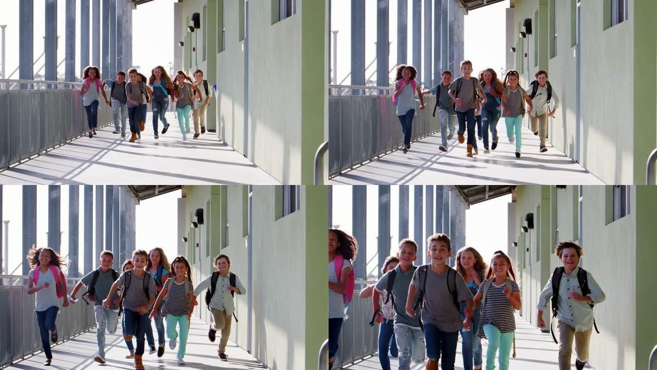 小学生在学校走廊上对着镜头奔跑