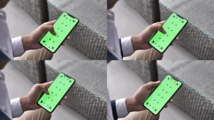 男子使用智能手机绿屏