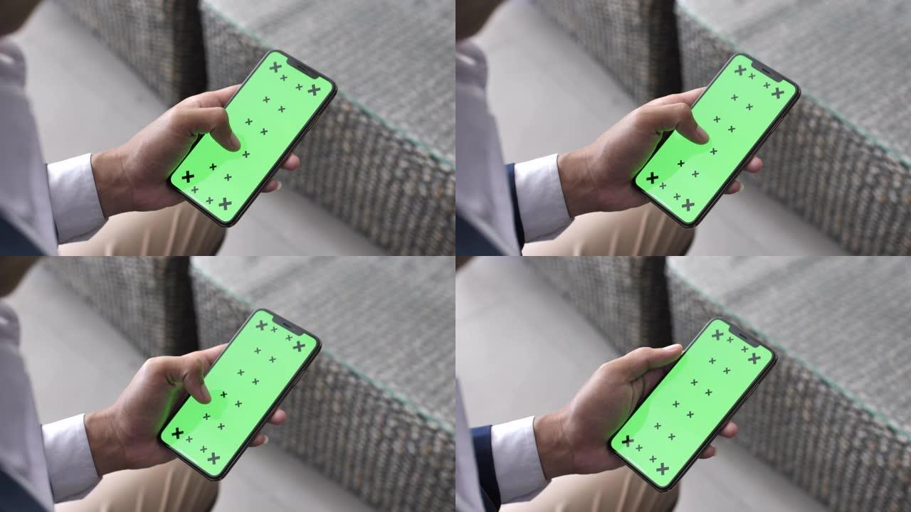 男子使用智能手机绿屏