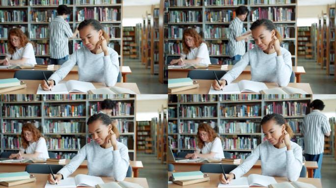 混血学生在图书馆学习，而其他人在背景中学习