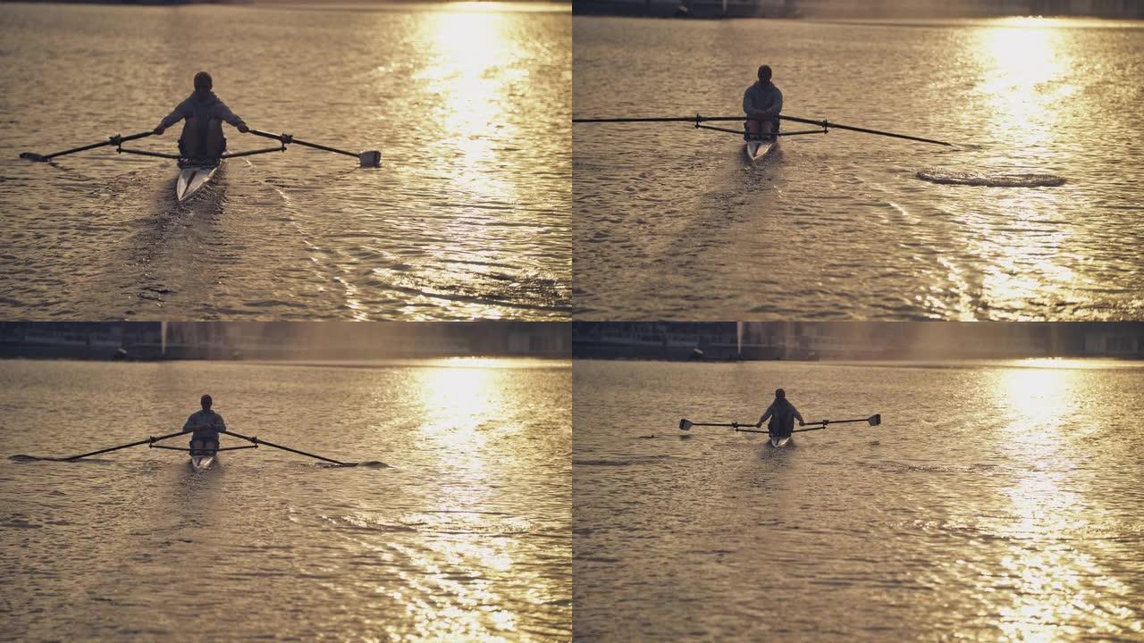 日落时在河里划船的人