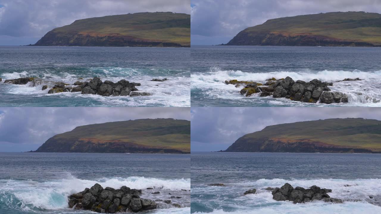 慢动作: 复活节岛的蓝色海浪坠入黑色火山岩
