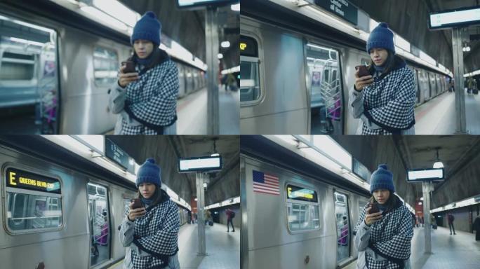 亚洲游客在地铁发短信