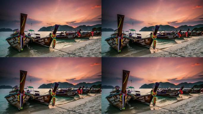 泰国，日落时海滩上的船只