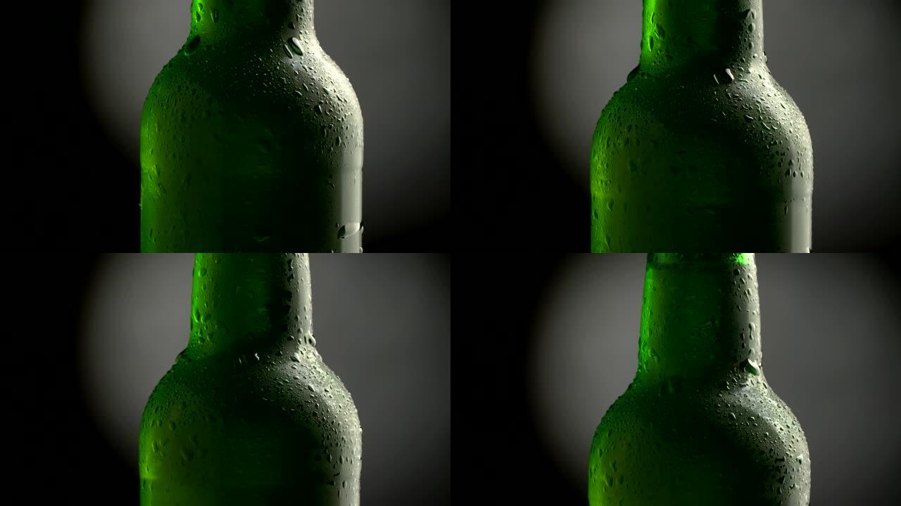 带冷凝液的冰啤酒。经典绿色瓶子。旋转倾斜拍摄。4K UHD