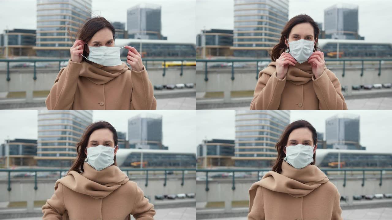 新型冠状病毒肺炎疫情保护、危险和恐惧气氛。美丽的高加索女人在外面戴面具的肖像。