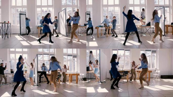 两个兴奋的办公室经理女人和快乐的多民族同事一起做疯狂有趣的胜利舞蹈。