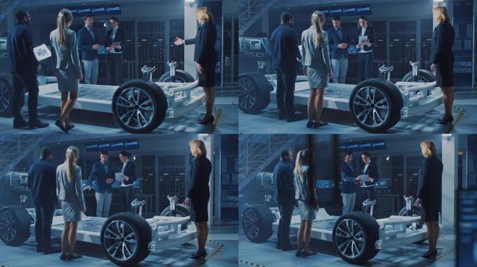 国际汽车设计工程师团队向一群投资者和商人介绍了未来的自主电动汽车平台底盘。屏幕显示3D cad软件