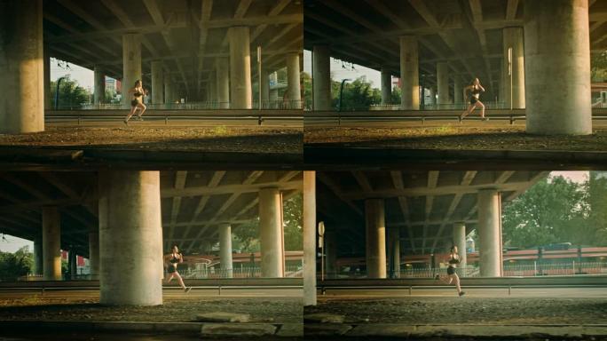 穿着黑色运动上衣和短裤的美丽健身女孩正在街上精力充沛地奔跑。她在城市环境中慢跑，背景是火车。