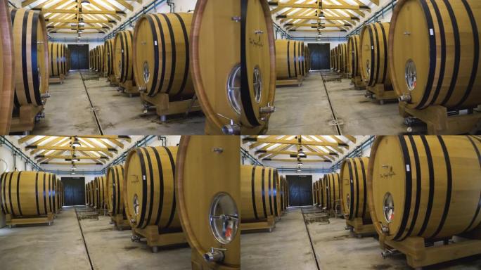 南非西开普省葡萄酒庄园的酒庄酒窖中的大型木制酒桶，用于发酵葡萄酒
