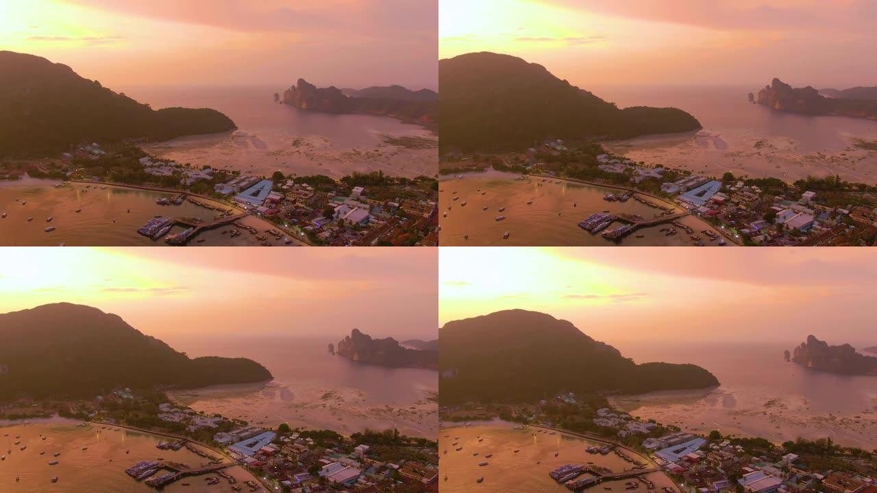 泰国甲米府披披岛全景。壮观的彩色日落在大海和岛屿上。热带和平静的印度洋的惊人黄昏。空中4k视图