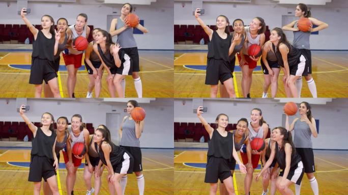 年轻的女子篮球队用智能手机自拍