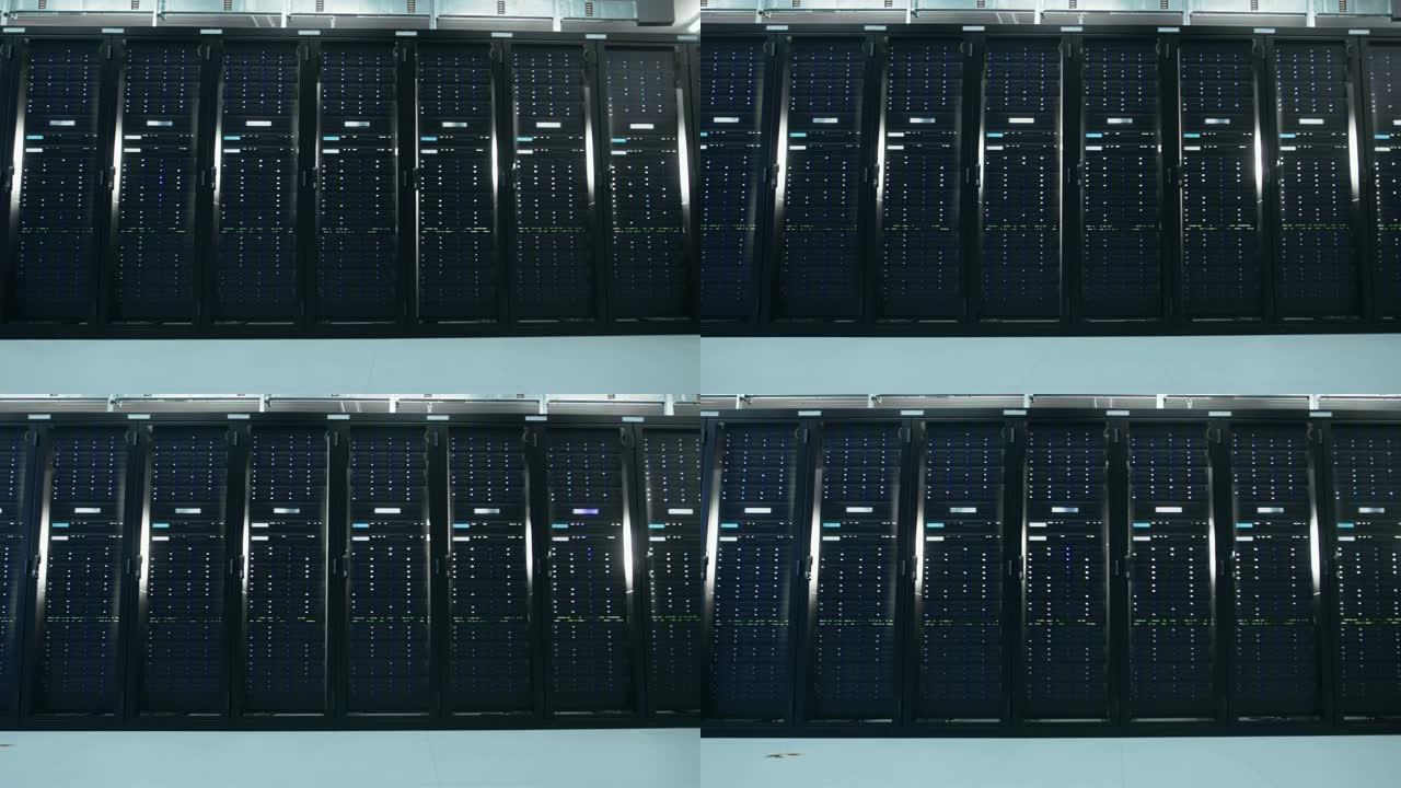 带有机架服务器行的工作数据中心的相机滑槽拍摄。Led灯闪烁，计算机正在工作。