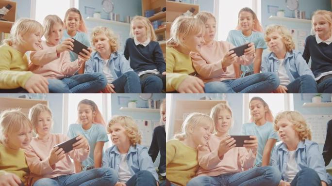 孩子们在互联网上浏览，在手机上玩在线视频游戏，看视频。一群可爱的小孩坐在一起的豆袋上，使用智能手机聊