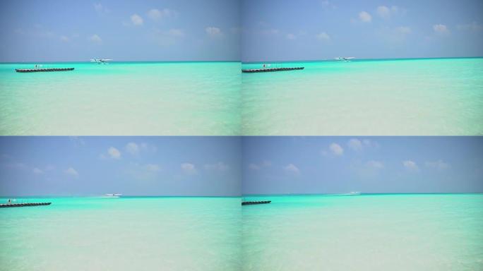 MS水上飞机在马尔代夫宁静，阳光明媚的蓝色海洋上起飞