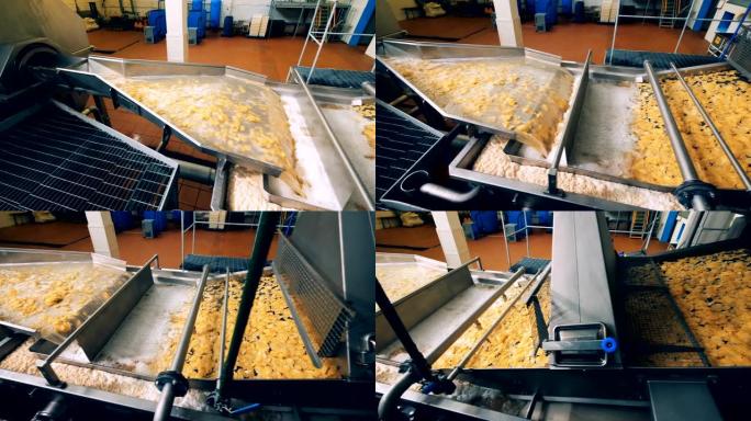 食品厂生产薯片，现代输送机在工作。
