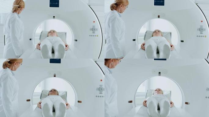 在医学实验室中，躺在CT或MRI扫描床上的女性患者在专业放射科医生的监督下接受扫描程序。病人在机器扫