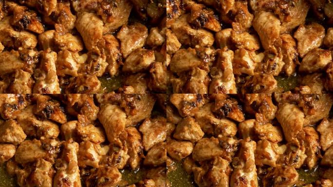 Chiken肉在平底锅中油炸。印度风味咖喱鸡肉。4K