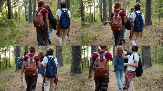 开朗的年轻人朋友走路说话的后视图-五