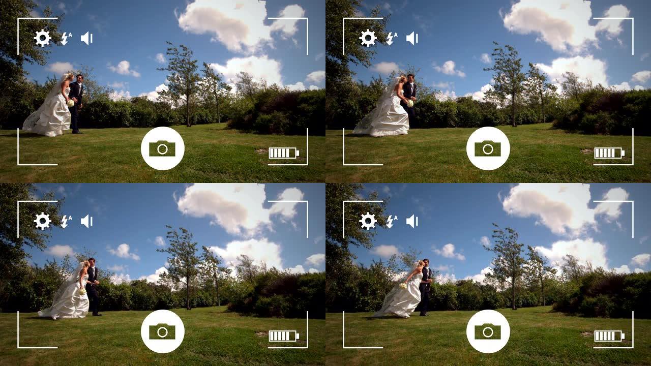 在数码相机上拍摄新娘和新郎的照片
