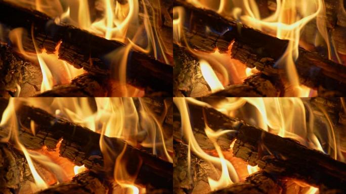木头在火中燃烧的慢动作镜头。燃烧钢坯