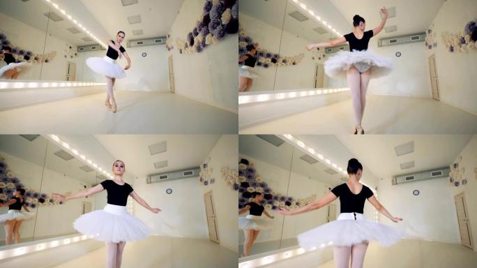 一名芭蕾舞演员在课堂上踮着脚旋转，特写镜头。