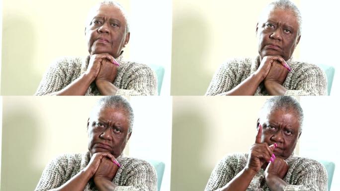 高级非裔美国妇女在镜头前wags手指