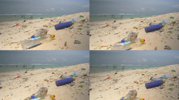 特写: 空的塑料瓶被淹没在热带白色沙滩上。