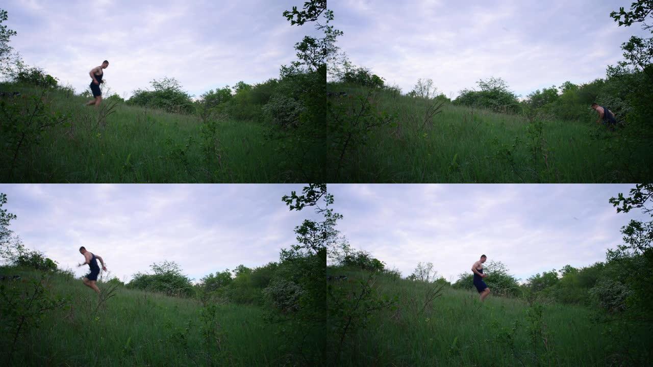 运动男子在草地上奔跑