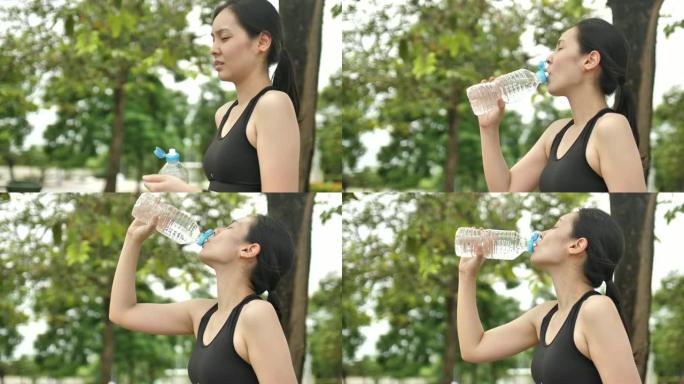 亚洲健身女子跑步后喝水