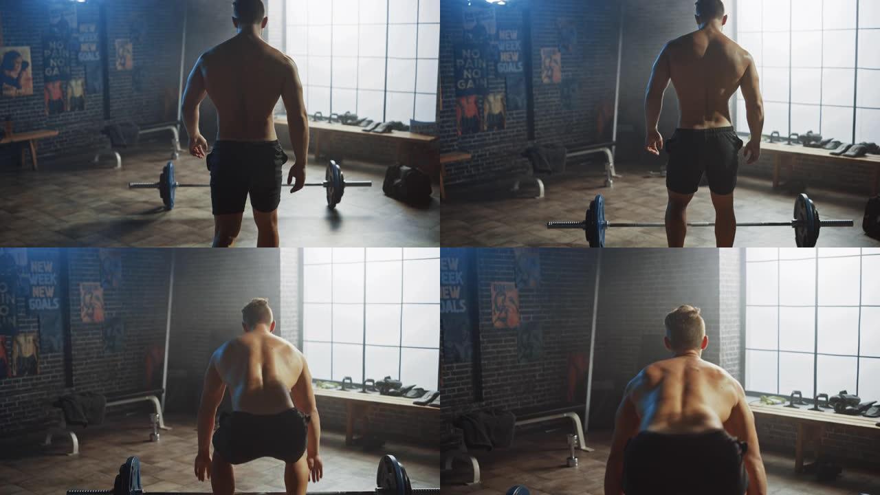 英俊的肌肉男在一个真正的小型健身房里用杠铃进行头顶硬拉。运动赤膊男子训练手臂肌肉，用杠铃锻炼。在铁杆
