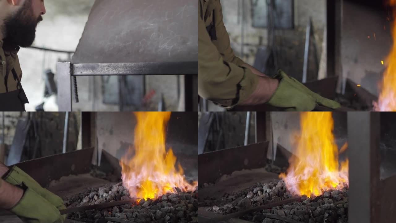 残酷的铁匠将钢坯放入燃烧的煤中
