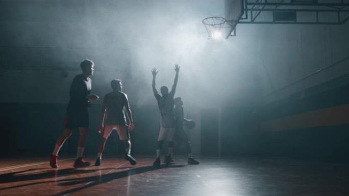 年轻职业男球员的电影慢动作特写镜头正在健身房练习篮球锻炼