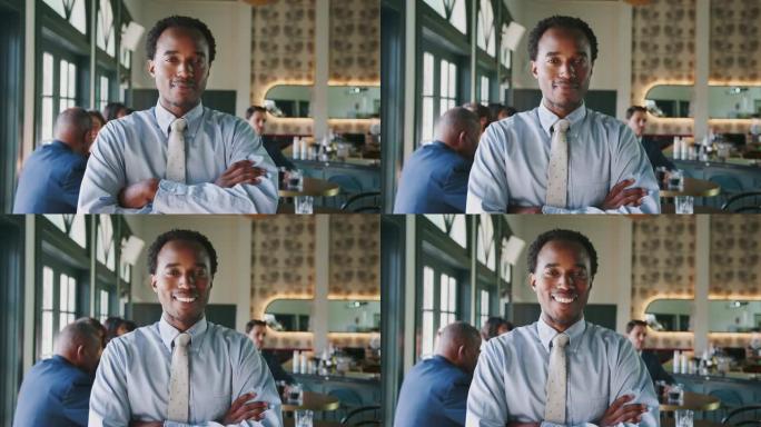 在繁忙的餐厅鸡尾酒吧中微笑的商人的肖像，背景是顾客