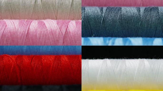 用缝纫线织物拍摄彩色卷的宏观照片。卷有各种颜色和色调，有缝纫针和线各种假发。