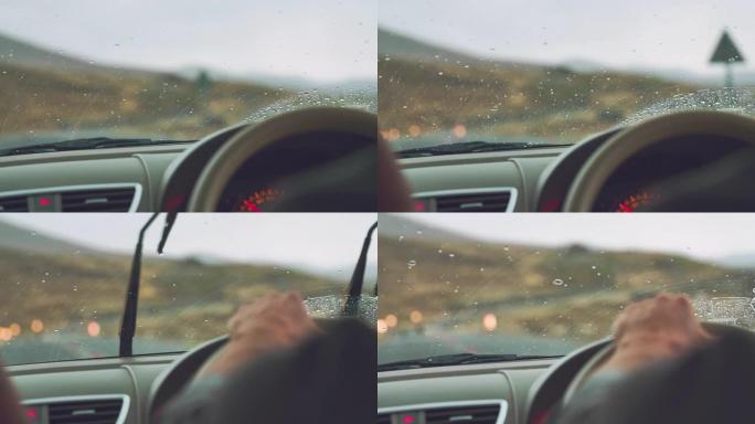 汽车在雨中行驶。驾车