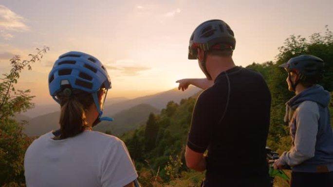 镜头耀斑: 阳光照耀着游客在自行车旅行中观察风景。
