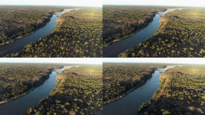 津巴布韦戈纳雷州国家公园的一条河的鸟瞰图，在河岸边有一个野生动物园小屋