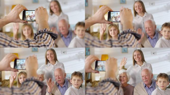 家人向智能手机相机挥手