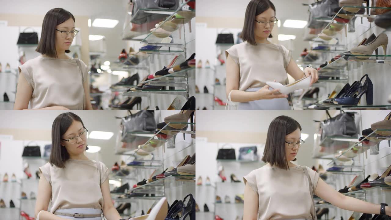 浏览鞋店的中国女人
